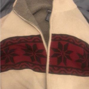Very warm Holiday sweater. Smoke free home,no stains,pulls excellent condition